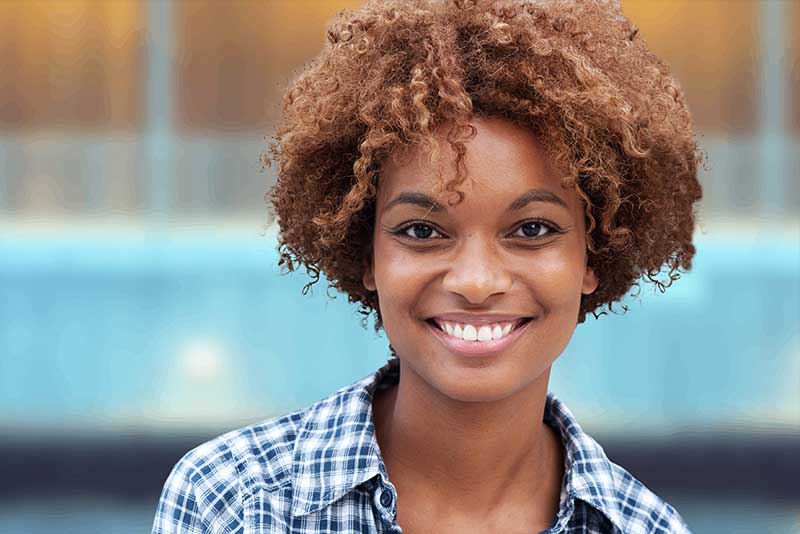 teeth whitening patient showing off new teeth